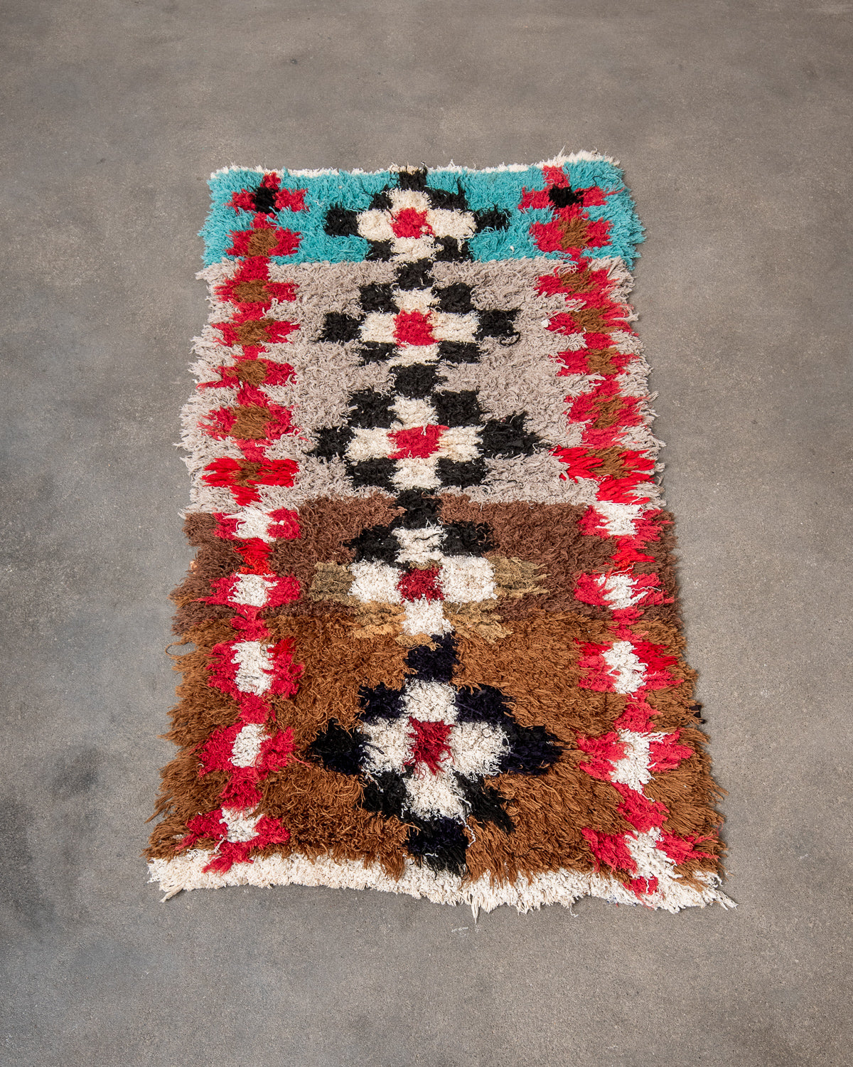 Modern designer vintage handcrafted Berber rug from Morocco. Boucherouite runner rug with beautiful colors and patterns.